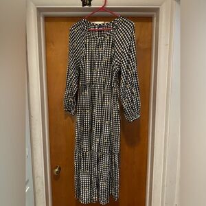 Black and white gingham with cute yellow embroidered flowers. POCKETS!